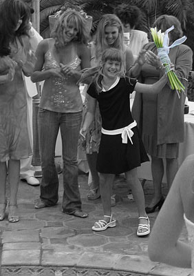 Palos Verdes girl catches the bouquet at the reception.